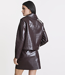 A woman in a glossy brown jacket and skirt stands against a plain white background. carousel Product Image 3