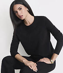 A woman in a black sweater and pants poses against a plain white background. carousel Product Image 2