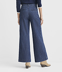 A person wearing pinstripe wide-leg pants and a beige sweater stands against a plain white background. carousel Product Image 3