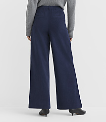 A person wearing wide-leg navy pants and a grey sweater stands against a plain white background. carousel Product Image 3