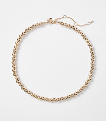 A rose gold beaded necklace with a delicate chain closure rests on a plain white background. carousel Product Image 1