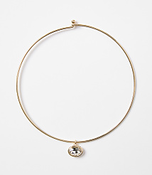 A delicate gold choker necklace with a single oval crystal pendant hangs against a plain white background. carousel Product Image 1