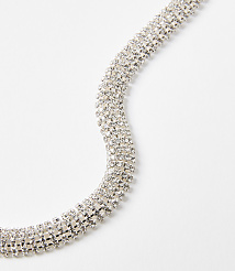 A sparkling, multi-layered rhinestone bracelet curves across a plain white background. carousel Product Image 2