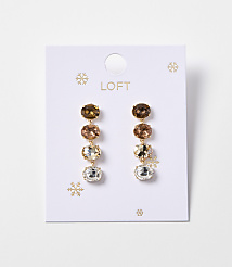 A pair of gold drop earrings with four oval-shaped gemstones in varying shades of brown and clear are displayed on a white card with snowflake accents and the "LOFT" logo. carousel Product Image 1