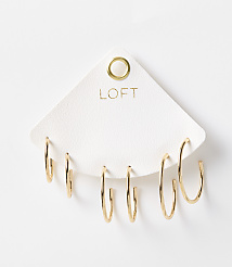 A set of six gold hoop earrings are displayed on a white triangular card with the "LOFT" logo, against a plain white background. carousel Product Image 1