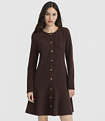 A woman in a brown textured dress with gold buttons stands against a plain gray background. carousel Product Image 2