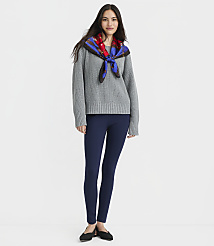 A woman in a gray sweater, navy leggings, and black flats stands against a plain gray background. carousel Product Image 1