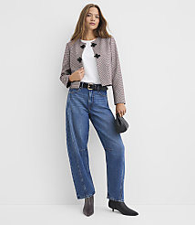 A woman in a patterned jacket and wide-leg jeans stands against a plain white background. carousel Product Image 2