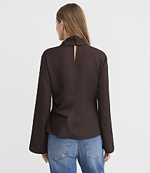 A woman in a brown blouse and blue jeans stands against a plain white background. carousel Product Image 3