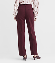 A person wearing burgundy pants and a floral blouse stands against a plain white background. carousel Product Image 3