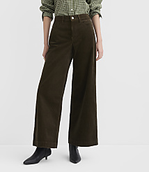 A person stands in wide-leg brown corduroy pants and black heeled boots against a plain white background. carousel Product Image 2