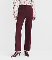 A person in a patterned blouse and burgundy trousers stands against a plain, light gray background. carousel Product Image 2
