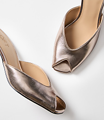 A pair of rose gold peep-toe mules with a pointed toe are displayed against a plain white background. carousel Product Image 2