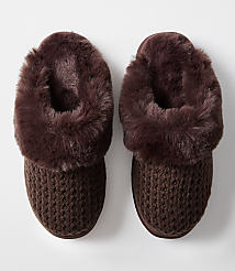 A pair of cozy brown knit slippers with fluffy trim rests on a plain white background. carousel Product Image 3