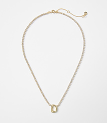 A delicate gold necklace with a single letter "D" charm rests on a plain white background. carousel Product Image 1