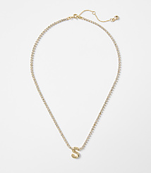 A gold letter "S" pendant hangs from a delicate, sparkling chain against a plain white background. carousel Product Image 1