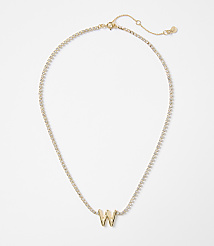 A gold letter "W" pendant is centered on a delicate, diamond-encrusted chain against a plain white background. carousel Product Image 1