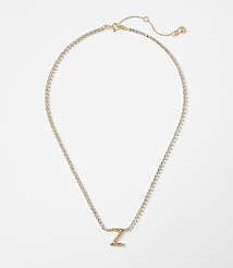 A gold letter "Z" pendant necklace with a delicate chain rests on a plain white background. carousel Product Image 1