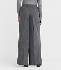 A person wearing gray pinstripe wide-leg pants and a gray sweater stands against a plain gray background. carousel Product Image 3