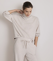 A woman in a beige loungewear set stands against a plain white background. carousel Product Image 2