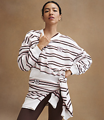 A woman in a striped sweatshirt and leggings stands against a plain brown background. carousel Product Image 4