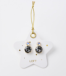 A pair of dark gray stud earrings with iridescent accents hang from a gold string on a white star-shaped card with gold speckles and the "LOFT" logo, set against a plain white background. carousel Product Image 1