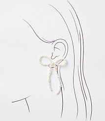 A pearl-encrusted bow earring dangles from a sketched ear against a white background. carousel Product Image 2