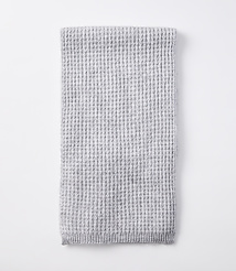 A folded light gray waffle-knit blanket rests on a plain white background. carousel Product Image 2