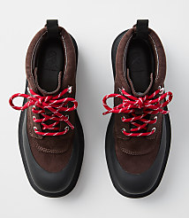 A pair of brown suede hiking boots with red and white laces are displayed against a plain white background. carousel Product Image 2