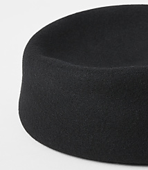 A black felt hat with a rounded crown sits on a plain white background. carousel Product Image 2