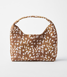 A small, brown and white spotted handbag with a curved handle sits on a plain white background. carousel Product Image 1