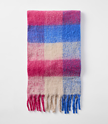 A fluffy, checkered scarf with pink, blue, and cream squares and fringed ends lies against a plain white background. carousel Product Image 2