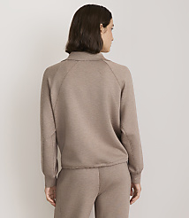 A woman in a taupe collared sweatshirt and matching pants stands against a plain white background. carousel Product Image 3