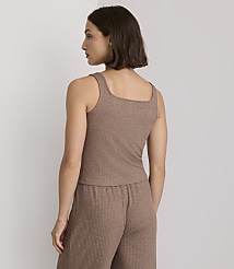 A woman in a brown ribbed tank top and matching pants stands against a plain, light-colored background. carousel Product Image 3