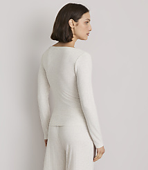 A woman in a light-colored ribbed top and pants stands against a plain, light gray background. carousel Product Image 2