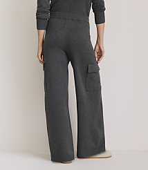 A person wearing dark gray knit cargo pants stands on a light-colored floor, with a plain, light background. carousel Product Image 3