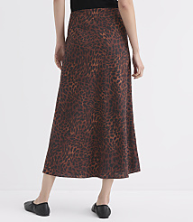 A person wearing a brown leopard-print skirt and black flats stands against a plain white background. carousel Product Image 3