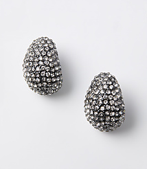Two oval-shaped, crystal-encrusted earrings rest on a plain white background. carousel Product Image 1