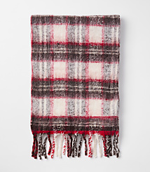 A fuzzy, red, white, and brown plaid scarf with fringe lies on a plain white background. carousel Product Image 2