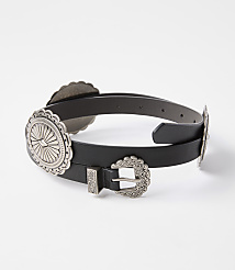 A black leather belt with ornate silver concho embellishments and a buckle rests against a plain white background. carousel Product Image 1