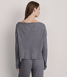 A woman in a grey ribbed sweater and pants stands against a plain grey background. carousel Product Image 3