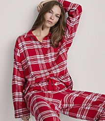 A woman in red plaid pajamas poses against a plain, light-colored background. carousel Product Image 2