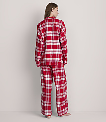 A woman in red plaid pajamas stands against a plain, light gray background. carousel Product Image 3