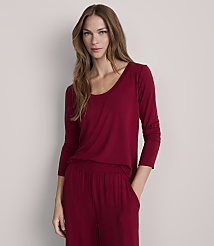 A woman in a maroon top and pants stands against a plain gray background. carousel Product Image 2
