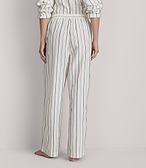 A person stands in striped pajamas against a plain, light-colored background. carousel Product Image 3