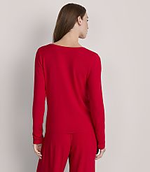 A woman in a red long-sleeved shirt and pants stands against a plain gray background. carousel Product Image 3