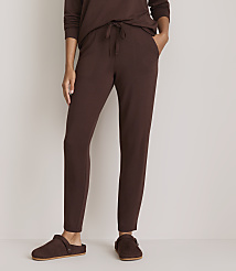 A person wearing brown pajamas and slippers stands against a plain white background. carousel Product Image 2