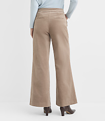 A person wearing wide-leg corduroy pants and brown heeled boots stands against a plain white background. carousel Product Image 3