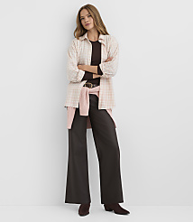 A woman in a plaid shirt and wide-leg pants stands against a plain white background. carousel Product Image 2