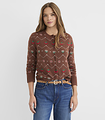 A woman in a patterned brown cardigan and blue jeans stands against a plain white background. carousel Product Image 2